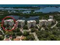 Aerial view of Meridian building and surrounding waterways at 385 N Point Rd # 402, Osprey, FL 34229