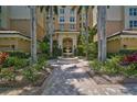 Courtyard with fountain and lush landscaping at 385 N Point Rd # 402, Osprey, FL 34229