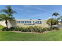 Mirror Lake community entrance sign with landscaping at 3875 59Th W Ave # 3875, Bradenton, FL 34210