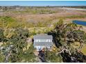 Aerial view of a two-story house nestled among trees at 412 30Th E St, Palmetto, FL 34221