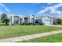 Beautiful one-story home with landscaped lawn and two-car garage at 4221 Augusta E Ter, Bradenton, FL 34203