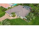 House with pool and tropical landscaping, seen from above at 462 Rubens E Dr, Nokomis, FL 34275