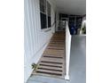 Accessible ramp with handrail leading to the home entrance at 510 50Th Avenue W Dr, Bradenton, FL 34207