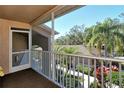 Private screened balcony overlooking trees and other condos at 5251 Mahogany Run Ave # 524, Sarasota, FL 34241