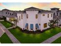 Stunning two-story home with unique architectural details and manicured lawn at 5902 Red Mangrove Ln, Bradenton, FL 34210