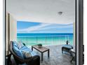 Spacious balcony overlooking the ocean with patio furniture at 603 Longboat Club Rd # 1102N, Longboat Key, FL 34228