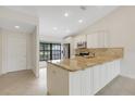 Modern kitchen with granite countertops and stainless steel appliances at 6085 Clubside Dr # 7682, Sarasota, FL 34243