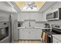 Modern kitchen featuring stainless steel appliances and white cabinets at 6131 Heritage Ln # 6131, Bradenton, FL 34209