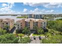 Condos overlooking a tranquil lake, showcasing resort-style living at 6310 Watercrest Way # 201, Lakewood Ranch, FL 34202