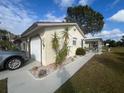 View of the side of the house and garage at 7564 Joppa St, North Port, FL 34287