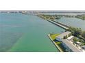 Wide aerial view of waterfront property with bridge and city views at 777 John Ringling Blvd # 2, Sarasota, FL 34236