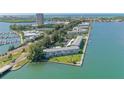 Aerial view showcasing waterfront community, pool, and boat slips at 777 John Ringling Blvd # 2, Sarasota, FL 34236