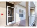 Condo entry with screen door, window, and carpeted flooring at 9630 Club South Cir # 6207, Sarasota, FL 34238