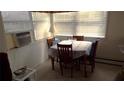 Small dining area with a table and four chairs at 12 Desoto E St, Bradenton, FL 34208