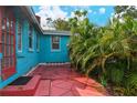 Quaint red patio and walkway next to house at 1330 Cocoanut Ave, Sarasota, FL 34236