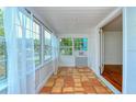 Bright sunroom with terracotta tile floor at 1330 Cocoanut Ave, Sarasota, FL 34236