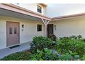 Private entryway with well-maintained landscaping at 1783 Lake Pl # 1783B, Venice, FL 34293