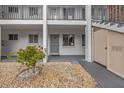 Condo unit entrance with small garden and storage at 2047 Canal Dr # L6, Bradenton, FL 34207