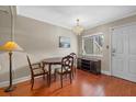 Dining area with wood table and chairs, hardwood floor at 2047 Canal Dr # L6, Bradenton, FL 34207