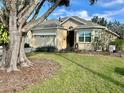 One-story home with a two-car garage and manicured lawn at 3312 92Nd E Ave, Parrish, FL 34219