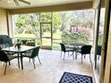 Screened patio with table and chairs, offering ample outdoor space at 3312 92Nd E Ave, Parrish, FL 34219