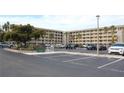 Condo building with parking and landscaping at 3682 Lake Bayshore Dr # K402, Bradenton, FL 34205