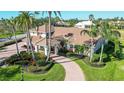 Luxury home showcasing a large backyard and landscaping at 4201 Palacio Dr, Sarasota, FL 34238