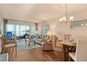 Living room with water views and hardwood floors at 4310 Falmouth Dr # A104, Longboat Key, FL 34228