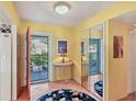 Bright entryway with mirrored closet and access to patio at 5055 Gulf Of Mexico Dr # 424, Longboat Key, FL 34228