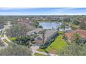 Luxury home with pool and lake view in a residential community at 5655 Eastwind Dr, Sarasota, FL 34233