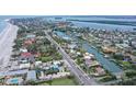 Aerial view of house near the beach and waterway at 5830 Gulf Of Mexico Dr, Longboat Key, FL 34228