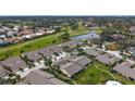 Aerial view of a villa nestled in a community by a golf course at 5911 Doral Dr, Sarasota, FL 34243