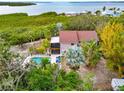 Home with private pool, lush landscaping, and waterfront views at 631 43Rd Street W Blvd, Palmetto, FL 34221