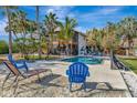 Inviting pool area with lounge chairs and tropical landscaping at 631 43Rd Street W Blvd, Palmetto, FL 34221