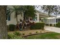 Landscaped yard with mature plants and gravel at 8414 Imperial Cir, Palmetto, FL 34221