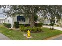 Side view of manufactured home with landscaping and fire hydrant at 8414 Imperial Cir, Palmetto, FL 34221