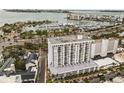 Aerial view showcasing highrise building near waterfront at 101 S Gulfstream Ave # 12C, Sarasota, FL 34236