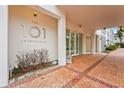 Condominium entrance with signage and landscaping at 101 S Gulfstream Ave # 12C, Sarasota, FL 34236