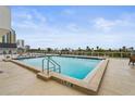 Sparkling rooftop pool with city views at 101 S Gulfstream Ave # 12C, Sarasota, FL 34236