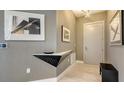 Modern entryway with sleek floating shelf and textured walls at 111 S Pineapple Ave # 1006, Sarasota, FL 34236