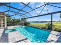 Screened pool and spa with a view of a lake and golf course at 12826 Sorrento Way, Bradenton, FL 34211