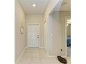 Light and airy entryway with tile floors and coat closet at 13262 Jeter Creek Dr, Riverview, FL 33579