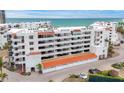 Oceanfront building, featuring multiple levels and private garages at 1465 Gulf Of Mexico Dr # 402, Longboat Key, FL 34228