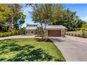 Contemporary home exterior with metal roof and charming landscaping at 1608 80Th Nw St, Bradenton, FL 34209