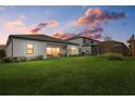 Spacious backyard with a screened patio and lush green grass at 16439 Slate Pl, Bradenton, FL 34211