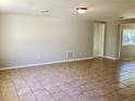 Bright living room featuring tile flooring and neutral walls at 320 Cardinal Rd, Venice, FL 34293