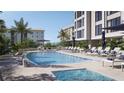 Relaxing pool area with lounge chairs, umbrellas, and views of tropical landscaping and nearby buildings at 325 Golden Gate Pt # 802, Sarasota, FL 34236