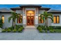 Elegant entryway with double doors and stone accents at 3354 Founders Club Dr, Sarasota, FL 34240