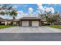 Two-car garage, and a double-wide driveway at 365 Oak Hill Way # 32, Sarasota, FL 34232