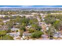 Aerial view showcasing the home's location near a waterfront and local businesses at 3902 11Th W Ave, Bradenton, FL 34205